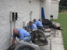 Coolray technicians installing Trane air cooling systems