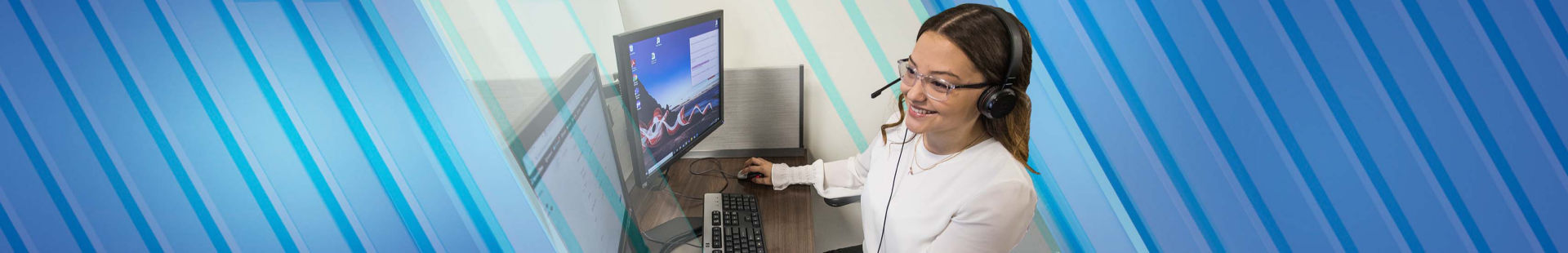 Woman with headset on in front of laptop