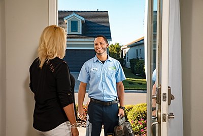 Smiling tech greeting woman