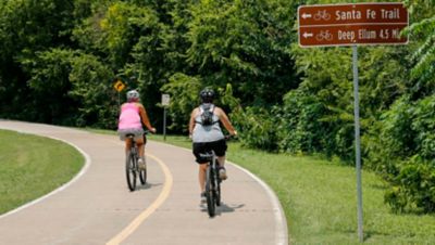 Cyclists ride along the White Rock Creek Trail at White Rock Lake in Dallas.