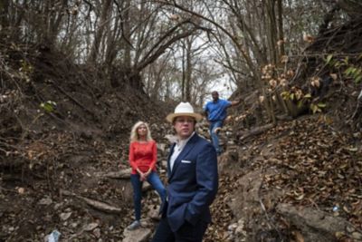 Robert Kent and colleagues standing near the bottom of a hill