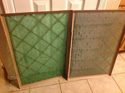 Dirty and clean fiberglass air filters side by side