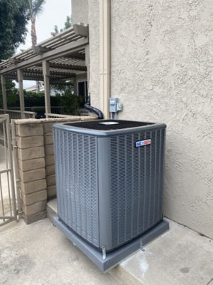 An AC unit connected to a building.