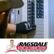 Ragsdale electrician inspecting an electrical panel in a Douglasville, GA home