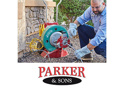 Parker & Sons plumber clearing a drain at a Tucson home