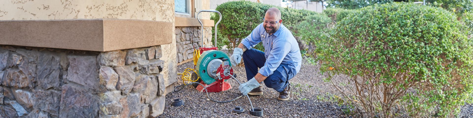 Technician jetting a drain and sewer system