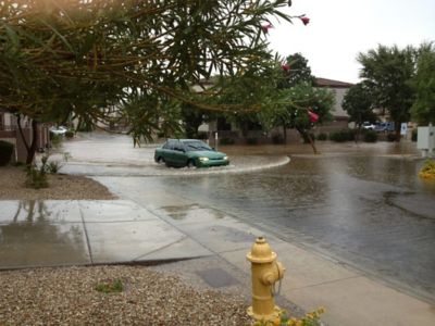 A car driving on a road during monsoon season