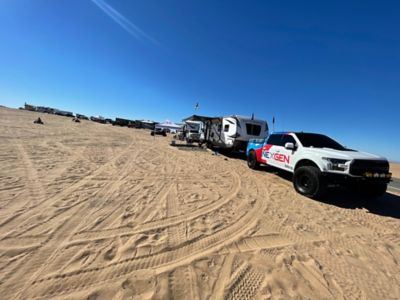 NexGen Truck pulling camper in the sand