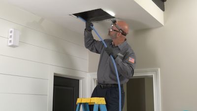 Tech cleaning air duct