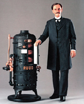 Edwin Rudd standing next to his invention a storage tank-type gas water heater