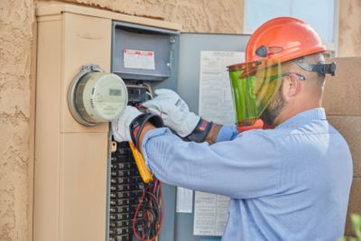 technician working on electrical panel 