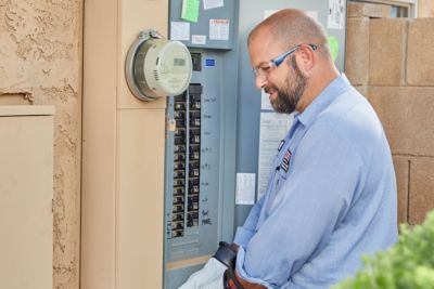 technician working on a electrical panel