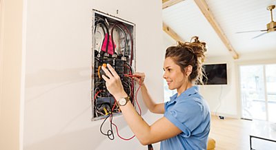 Electrician repairing electrical panel