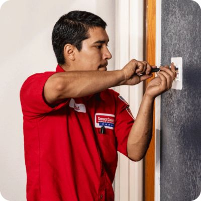 Technician Repairing Light Switch