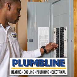 Plumbline electrician inspecting an electrical panel in a Broomfield home