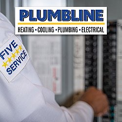 Plumbline electrician checking an electrical panel in a Frederick home