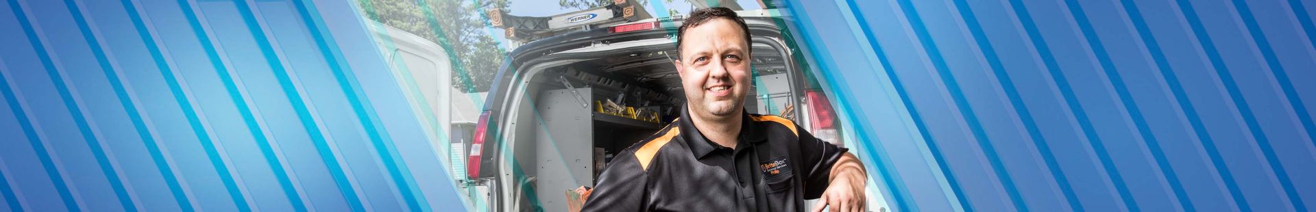 Electrician posing in front of his truck