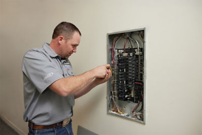 Electrician repairing electrical panel