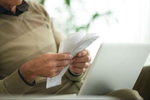  A person holding papers in their hands