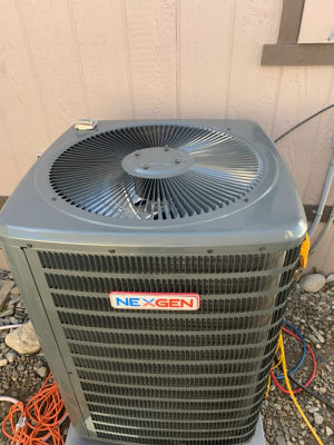 A NexGen AC Unit next to a building.