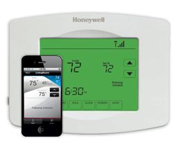 Honeywell Wireless thermostat behind a cellphone