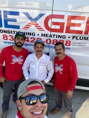 Four NexGen Techs taking a selfie outside a NexGen Van