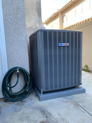 An AC unit connected to a building.