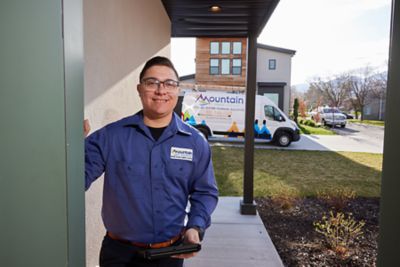 Friendly technician at front door