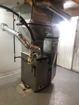 A furnace unit installed in a home's basement 