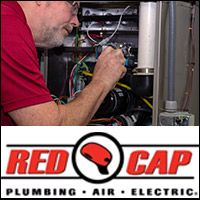 HVAC tech repairing a furnace