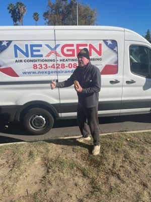 Person Standing in front of NexGen Van