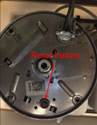 View of reset button from bottom of garbage disposal