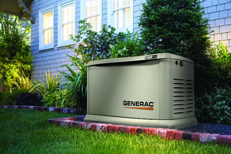 A photo of the generac generator on the side of the house. 