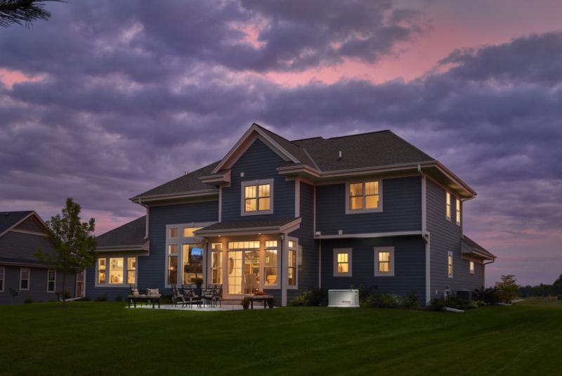 A photo of a generac house generator lighting a home