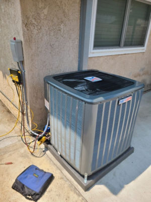 An AC unit connected to a building.