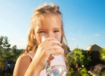 Little Girl Drinking Glass of Water