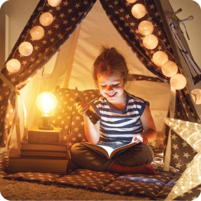 Girl Reading In Tent