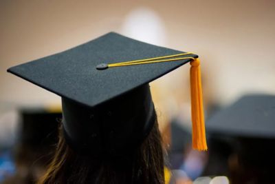 Back view of graduation cap and gold tassle