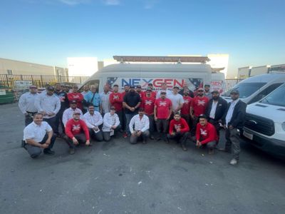 NexGen Team posed in front of NexGen Van