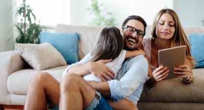 Happy family with an iPad