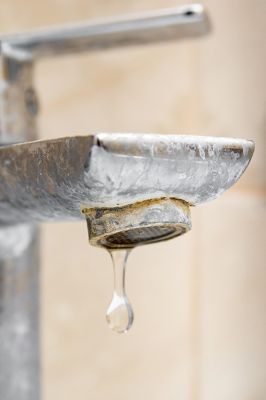 An indoor faucet with build-up caused by hard water.