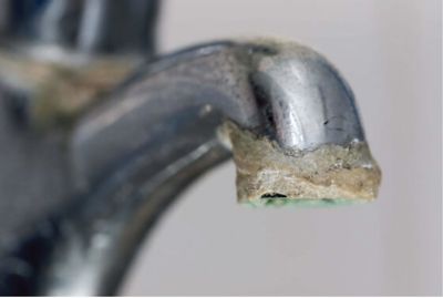 Hardwater buildup on a water faucet