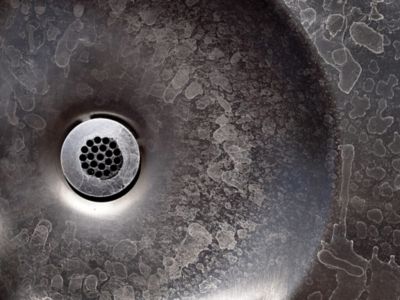 Hard water shown in the sink drain.