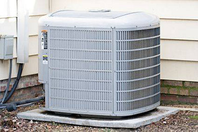 Central air conditioning unit outside of house
