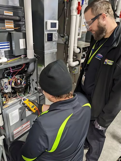 A man working on an electrical panel