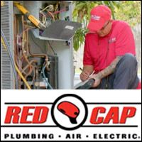 HVAC technician repairing a heating system