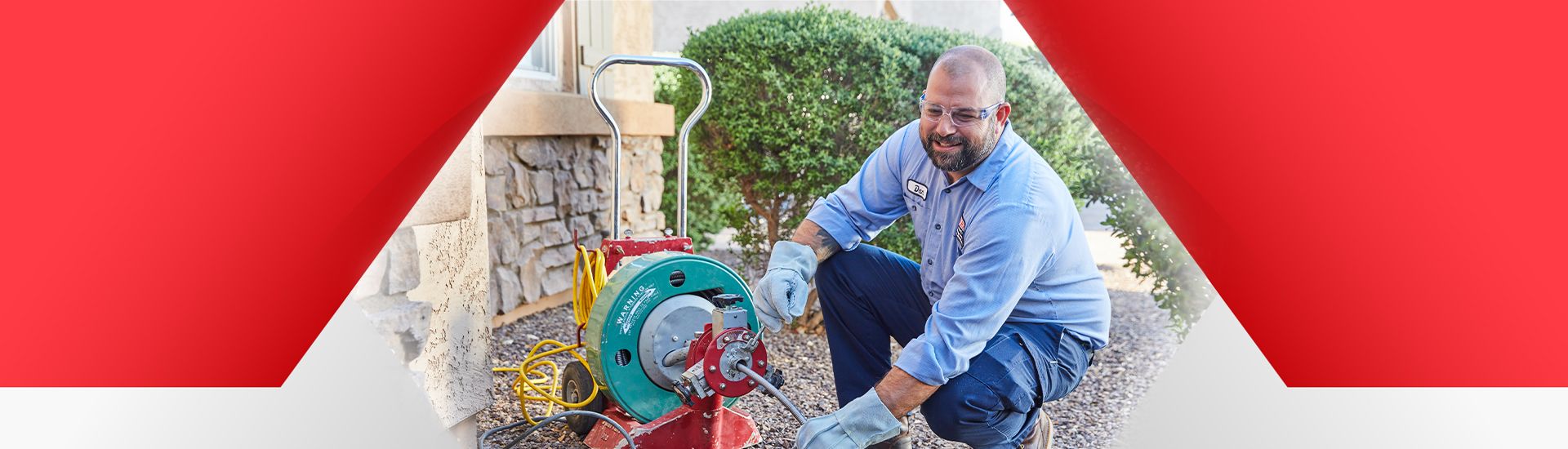 Technician jetting a drain in a home