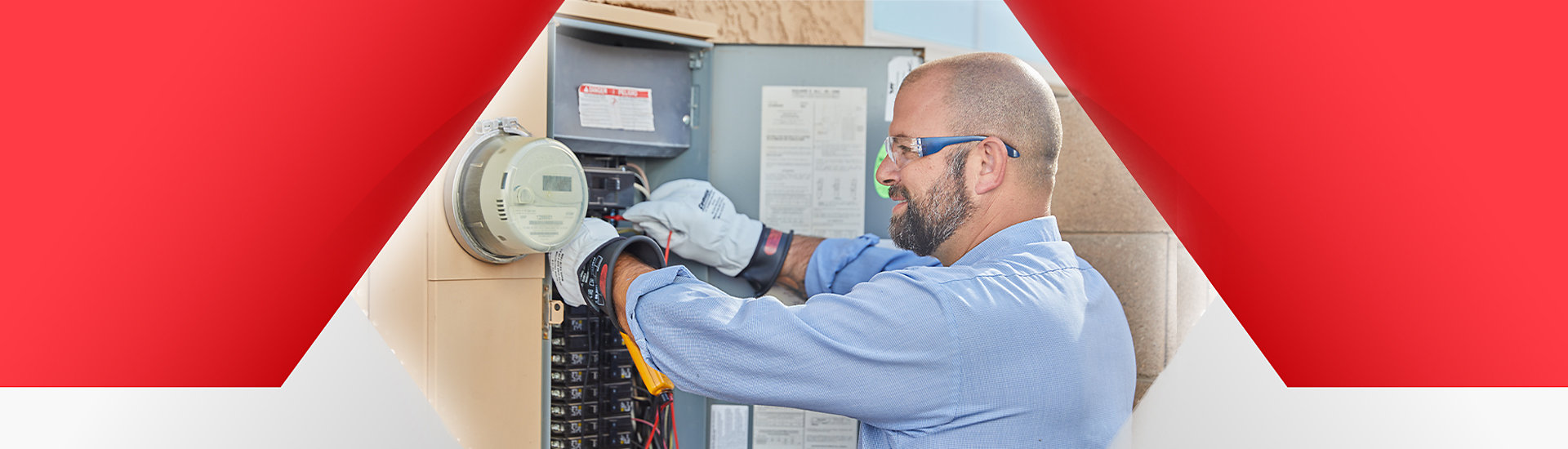 Electrician inspecting electrical panel