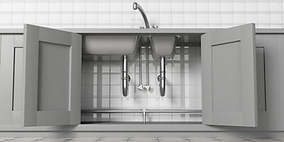 Grey cabinets open with chrome sink and white tile in background