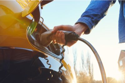 homeowner charging their electric vehicle at home